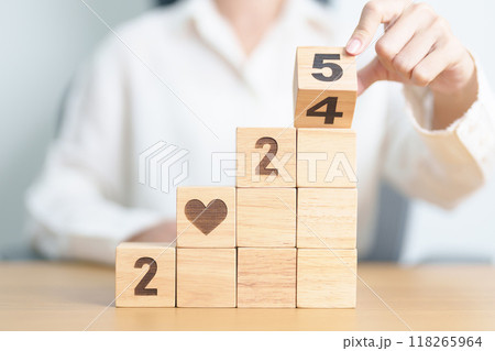 2024 end year to Happy New Year 2025 with heart block for health care, love, organ donation, resolution, charity, happy family, wellbeing and insurance concepts 118265964