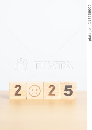 Happy New Year 2025 with Sad face block. Satisfaction, feedback, Review, mental health, eco sustainable and bad year concept 118266009