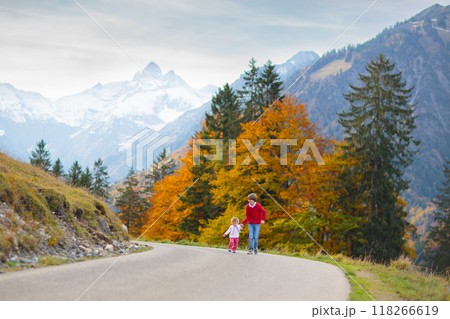 Family with kids hiking in the mountains 118266619