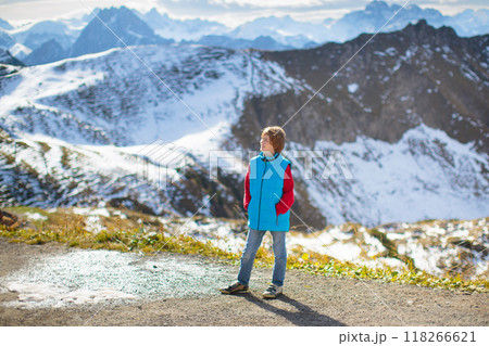 Family with kids hiking in the mountains 118266621