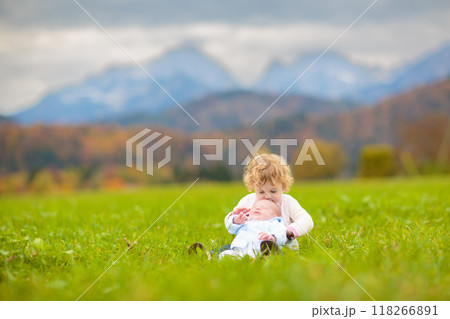 Family with kids hiking in the mountains 118266891