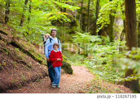 Father and kids hike in the mountains Father and kids hike in the mountains 118267195