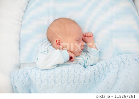Newborn baby boy in white bassinet Newborn baby boy in white bassinet 118267261