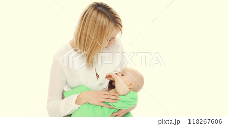 Happy mother breastfeeding her baby on white background Happy mother breastfeeding her baby on white background 118267606