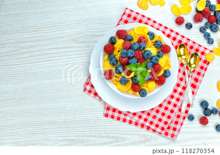 cornflakes, breakfast of cornflakes and berries cornflakes, breakfast of cornflakes and berries 118270354