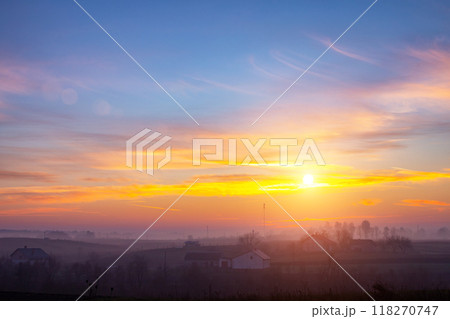sunset in the field. beautiful autumn foggy landscape in Ukraine 118270747