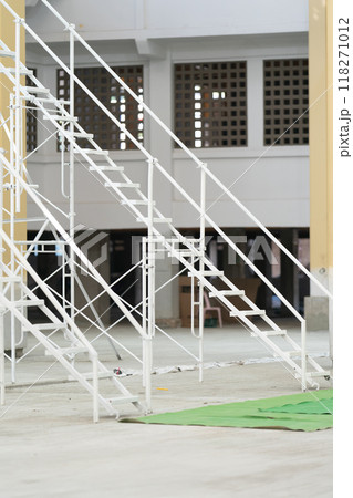 The steel used to construct the white scaffolding ladder is sturdy and long lasting. The steel used to construct the white scaffolding ladder is sturdy and long lasting. 118271012