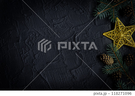 Christmas background with fir tree and decor on dark background. Top view with copy space 118271096