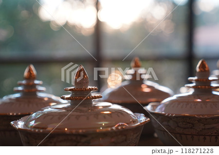 Thai bowl set on table prepare for give food offerings to a Buddhist monk in the morning. People usually prepare rice, dishes and flower offer food to monk. 118271228