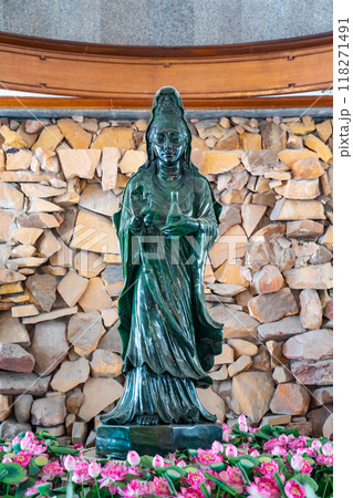 The Big Jade Guanyin goddess of mercy standing on lotus, In Dhammamongkol temple, Bangkok Thailand. Chinese goddess. Pure Green Jade. The Big Jade Guanyin goddess of mercy standing on lotus, In Dhammamongkol temple, Bangkok Thailand. Chinese goddess. Pure Green Jade. 118271491