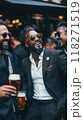 Group of men of different nationalities, dressed in stylish business suits, meeting at luxurious bar, relaxing with beer after work, standing outdoors 118271519