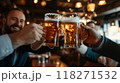 Group of men in business suits raising their glasses of beer, smiling and clinking glasses to celebrate successfully completed project, deal. 118271532