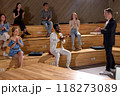 Side view On group of people congratulating celebrating, clapping hands during conference 118273089