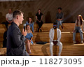 Side view caucasian male speaker giving talk in conference hall at business meeting event 118273095