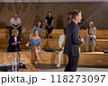 Side view male speaker in suit giving talk on corporate business meeting 118273097