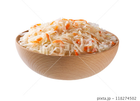 fermented white cabbage with carrot in a wooden bowl isolated on white background. 118274502