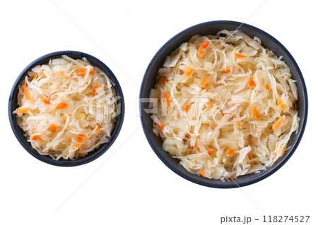 fermented white cabbage with carrot in a black ceramic bowl isolated on white background. Top view. 118274527