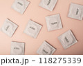 Condoms background pink. Pattern from mens contraception. Sexually transmitted diseases infections protection. Concept of birth control. Safe sex. STD. View from above. High quality photo 118275339