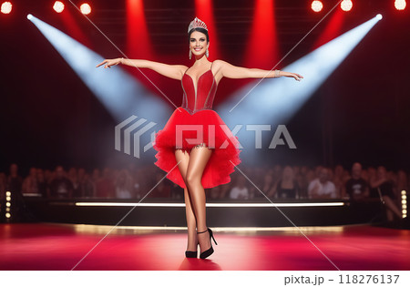 Portrait of a beautiful female dancer posing in a red dress on stage 118276137
