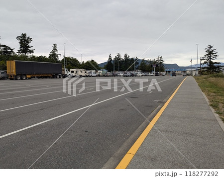 Anacortes, Washington, USA - 06.26.2024: A line of vehicles at the Anacortes port ferry terminal Anacortes, Washington, USA - 06.26.2024: A line of vehicles at the Anacortes port ferry terminal 118277292
