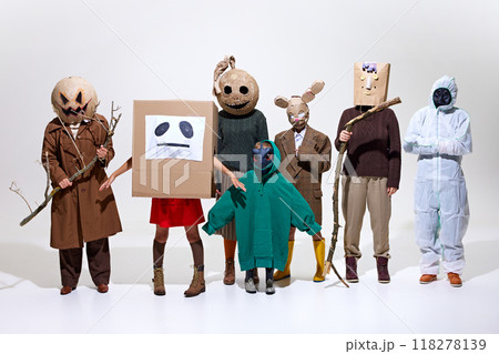 Group of people, family and friends wearing creepy homemade costumes isolated on white background. Creepy season. 118278139