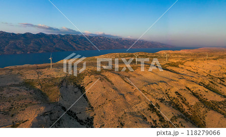 Aerial view of wind farm standing on the hill of island Pag surrounded by Adriatic sea, Croatia.  118279066