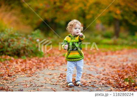 Kids playing in autumn park 118280224