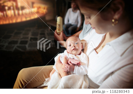 Baptism of newborn baby in Catholic church. 118280343