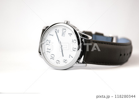 A close up of a wristwatch with a black leather strap. High quality photo 118280344