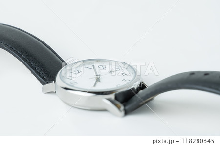 A close up of a wristwatch with a black leather strap. High quality photo 118280345