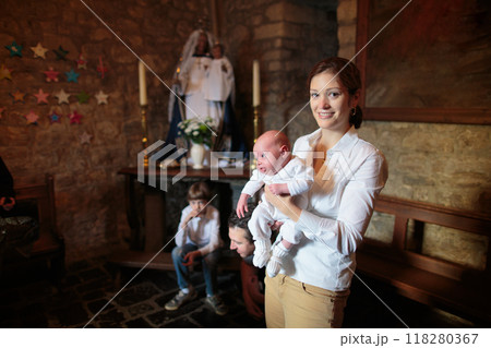 Baptism of newborn baby in Catholic church. Baptism of newborn baby in Catholic church. 118280367