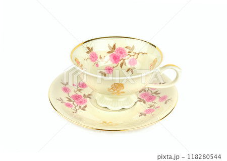 Vintage porcelain cup and saucer isolated on white. Vintage porcelain cup and saucer isolated on white. 118280544