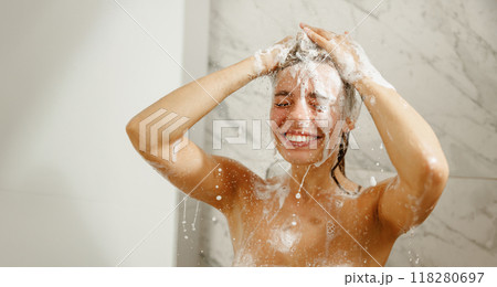 A Happy Woman is Enjoying a Refreshing and Invigorating Shower Experience Each Day A Happy Woman is Enjoying a Refreshing and Invigorating Shower Experience Each Day 118280697