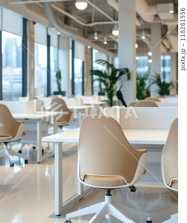 Empty modern bright open business coworking with furniture, tables with partitions, swivel chairs, plants, well illuminated and working atmosphere 118281556
