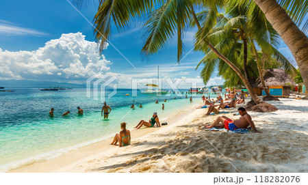 Tourists Relaxing on a Pristine Tropical Beach with Clear Blue Waters 118282076