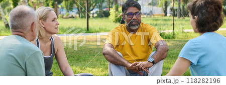 People listening to yoga instructor People listening to yoga instructor 118282196
