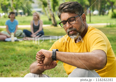 Looking at watch while checking time 118282281