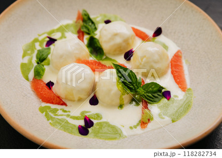 Gourmet cheese balls with herbs and citrus on an plate, perfect for culinary and food photography 118282734