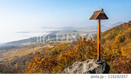 Experience the breathtaking view from Laffita Lookout Point atop Krizova Mountain, showcasing autumn colors and expansive landscapes of the Central Bohemian Uplands in Czechia. 118282937