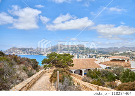 Stunning Aerial Scenery Calpe Spain Costa Blanca Beaches Penon de Ifach Rock Mediterranean Vegetation Sunny Day Tourism Destination. Idyllic Coastal Panorama Calpe Spain Azure Waters Sandy Beaches 118284464