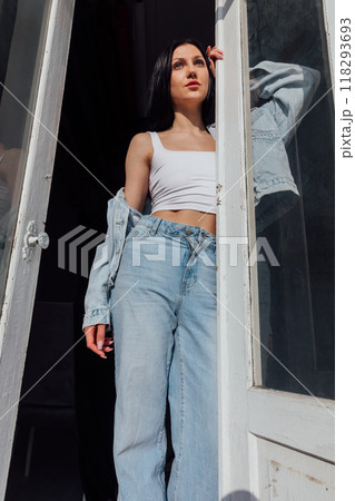 Beautiful fashionable brunette woman in jeans and outdoor t-shirt 118293693