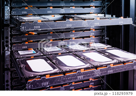Cluster of hard drives inside open tray 118293979