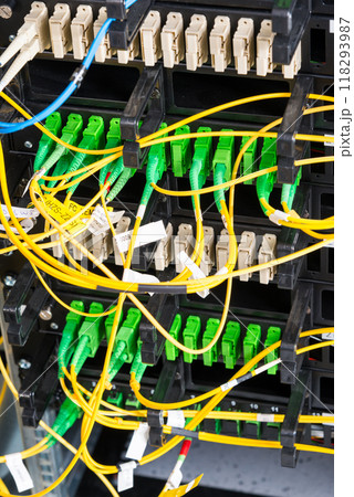 Fiber Optic cables connected to an optic ports 118293987
