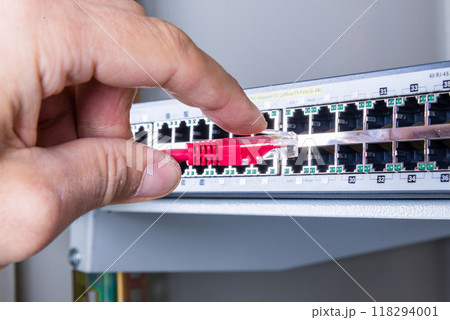 hand with red ethernet cable hand with red ethernet cable 118294001