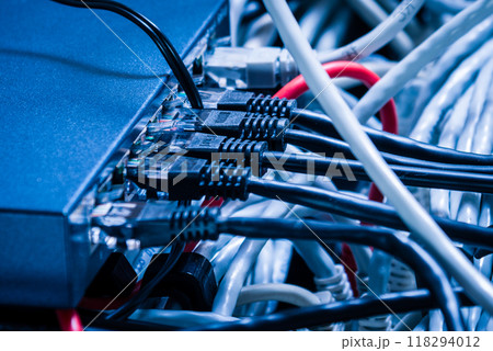 Detail of server room with bunch ethernet cables at the back of 118294012