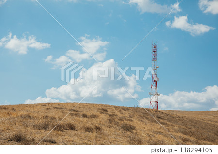 Cell tower with antennas on the top of the mountain Cell tower with antennas on the top of the mountain 118294105