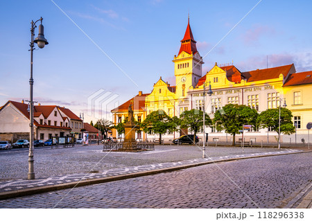 Marianske Square in Stara Boleslav glows in the evening light as the Town Hall stands majestically nearby. The quiet square invites evening strolls amid historical architecture. 118296338