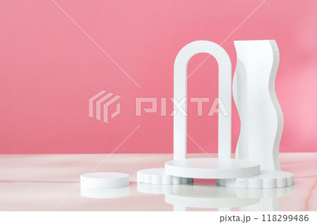 Decorative podiums against pink background in studio 118299486