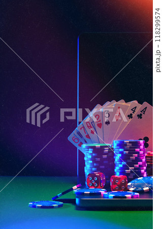 Laptop With Playing Cards and Poker Chips on a Green Table Laptop With Playing Cards and Poker Chips on a Green Table 118299574