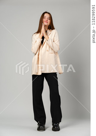 Young Woman in Black Shirt and Black Pants in Studio Young Woman in Black Shirt and Black Pants in Studio 118299591